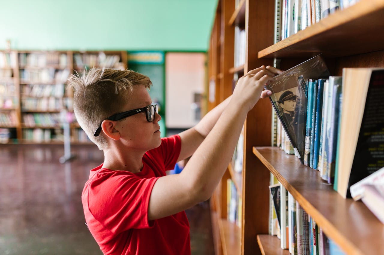 Person shelving a book